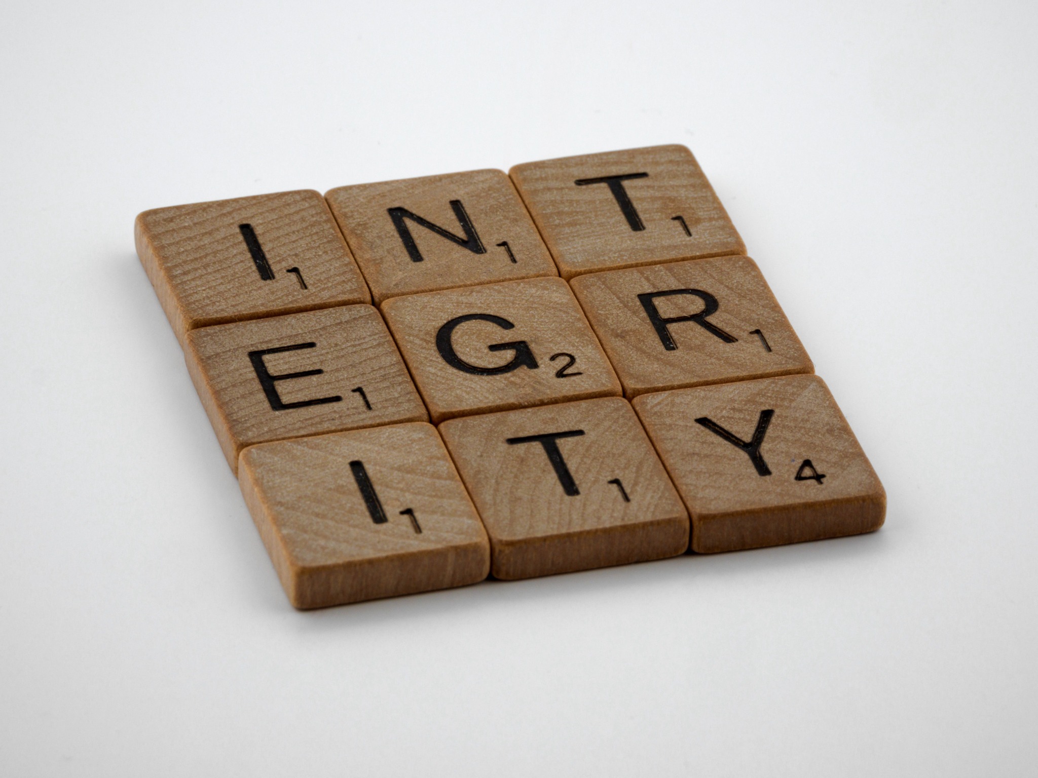 Wooden letter tiles spelling the word integrity